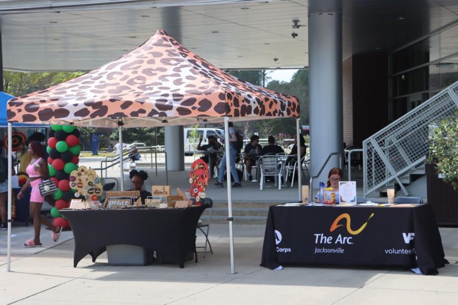 Various organizations and vendors set up tables at Jax Melanin Market Meets Market Days, waiting for students to stop by.