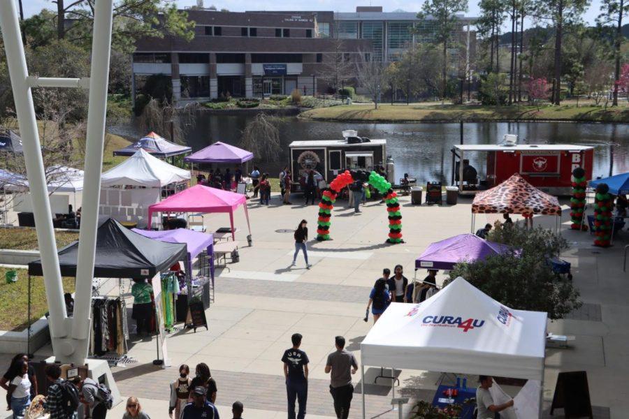 UNF students walk through Jax Melanin Market Meets Market Days, speaking to local vendors and organizations.