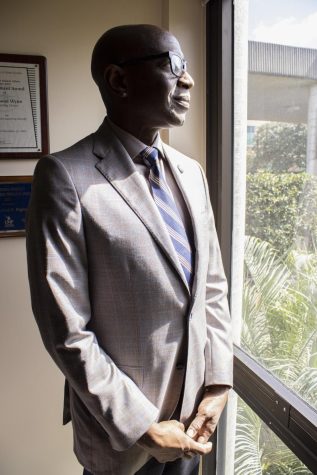 Dr. Richmond Wynn looks out the window of his office in the Counseling Center.