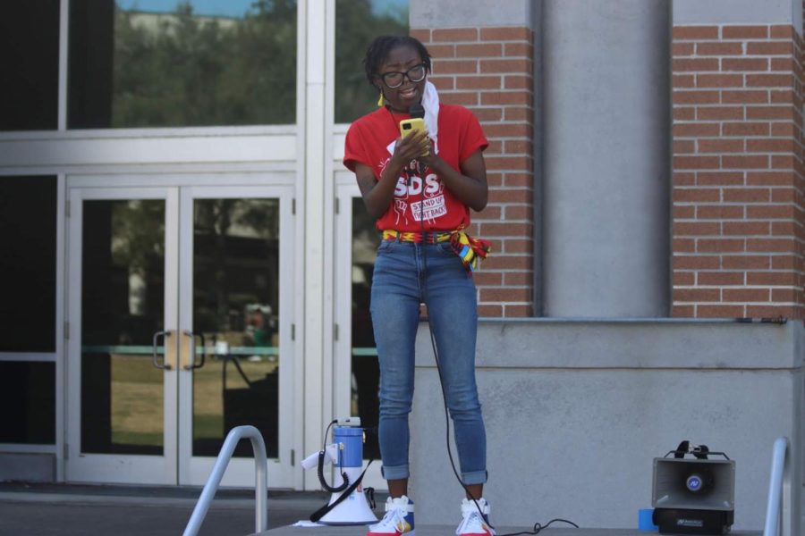 SDS member reads a speech voicing opposition for HB 5 and HB 167 on the University of North Florida Green in Jacksonville, Florida, Wednesday, Feb. 16.