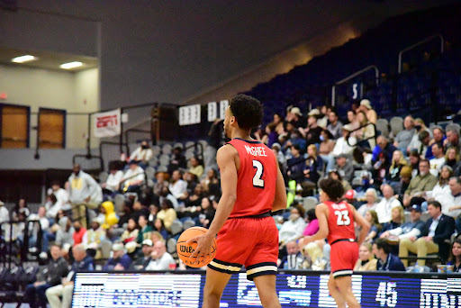 Liberty guard Darius McGhee takes the ball down the court during the second half of the game  at UNF Arena in Jacksonville, Florida, Tuesday, Feb. 15.