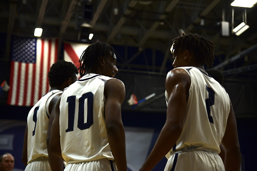 Teammates Jarius Hicklen (10) and Chaz Lanier (2) speak with each other following a whistle in Wednesday’s game.