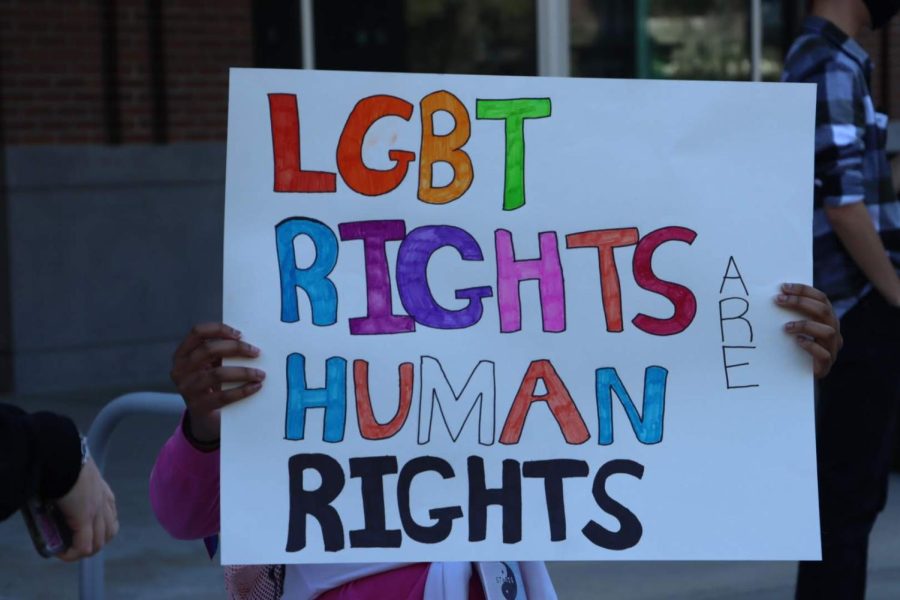 “LGBT RIGHTS ARE HUMAN RIGHTS” reads a sign at a protest against anti-LGBT legislation in Florida on March 2, 2022, on the UNF Green.