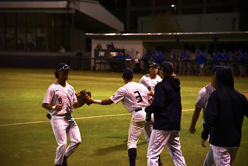 UNF second baseman Aidan Sweatt (3) congratulates fellow infielder Isaiah Byars (8) following an inning against the Florida Gators.