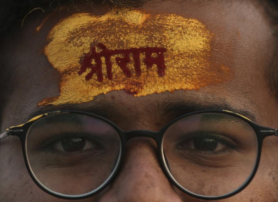 A devotee has the name of Hindu god Rama written on his forehead during a religious procession to celebrate Ram Navami, a Hindu festival marking the birth anniversary of Lord Ram