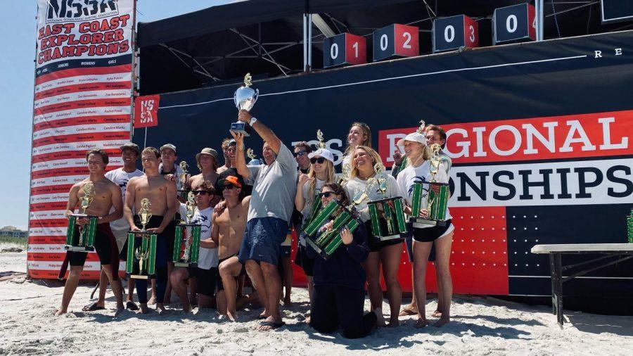 The University of North Florida Surf Team holds their trophies at the East Coast Championship in New Smyrna Beach.