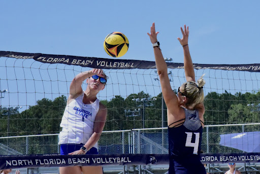 UNF’s Zoe Cahill reaches above the net to counter a Georgia State spike on Friday. 