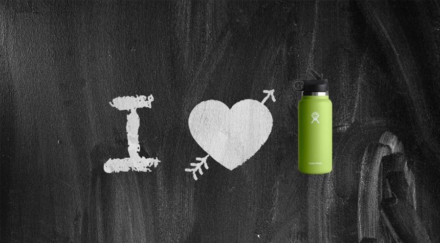 White lettering of I, a heart with an arrow through it and a green water bottle on a chalkboard background