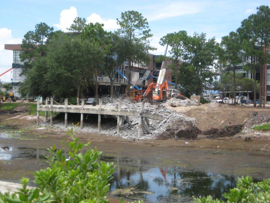 View from across Boathouse Lake, construction crew razing the Boathouse deck and foundation in 2008. 