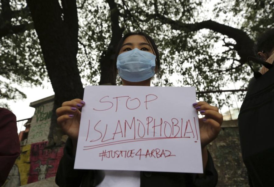 A woman holds a placard during a protest against the killing of a Muslim man last Sept.