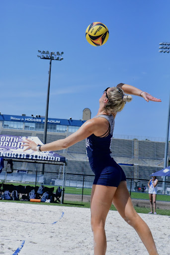 UNF’s Zoe Cahill prepares to send a serve over the net, an initial key to coming out on top of a volley and securing a point.
