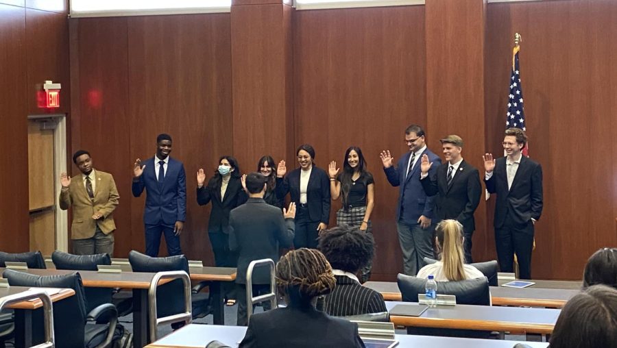 Nine students were sworn in as senators by Associate Justice Aaron Colina on April 15, 2022.
