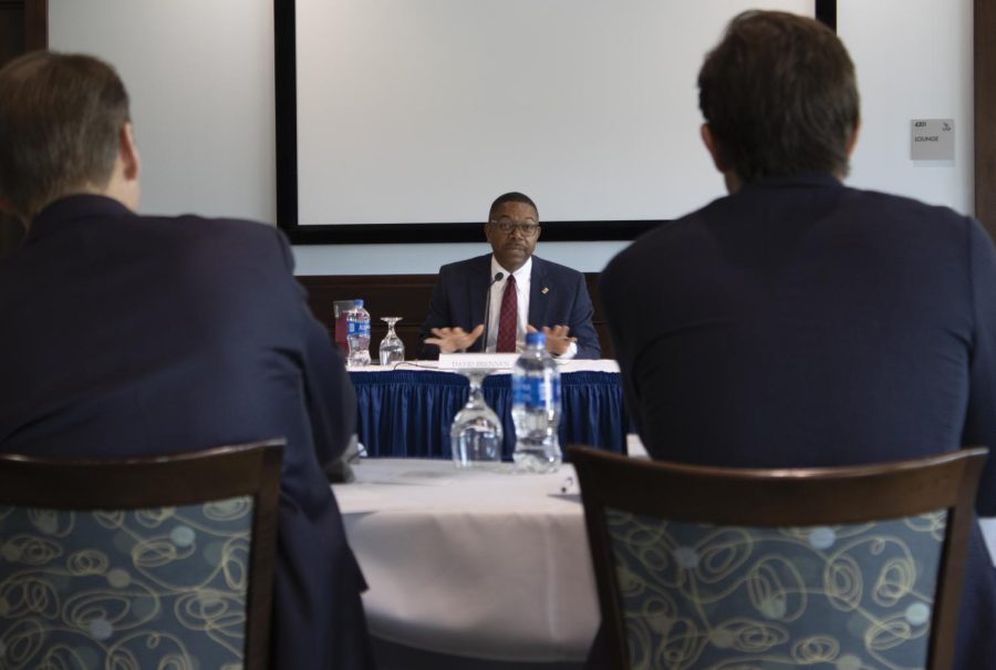 The University of North Florida Board of Trustees listens as David Brennen (center) answers a question during his final interview