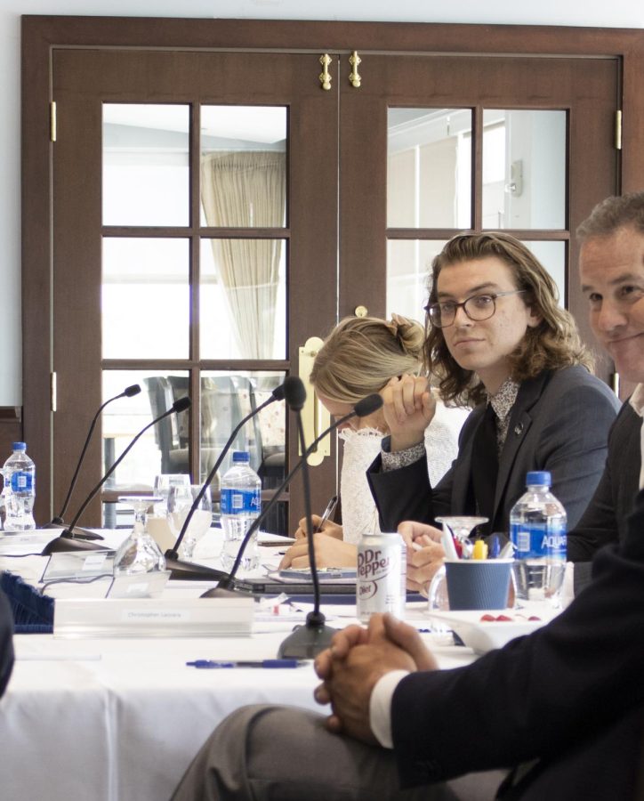 University of North Florida Board of Trustees member Nathaniel Rodefer listens to Chairman Kevin Hyde during the final day of presidential candidate interviews