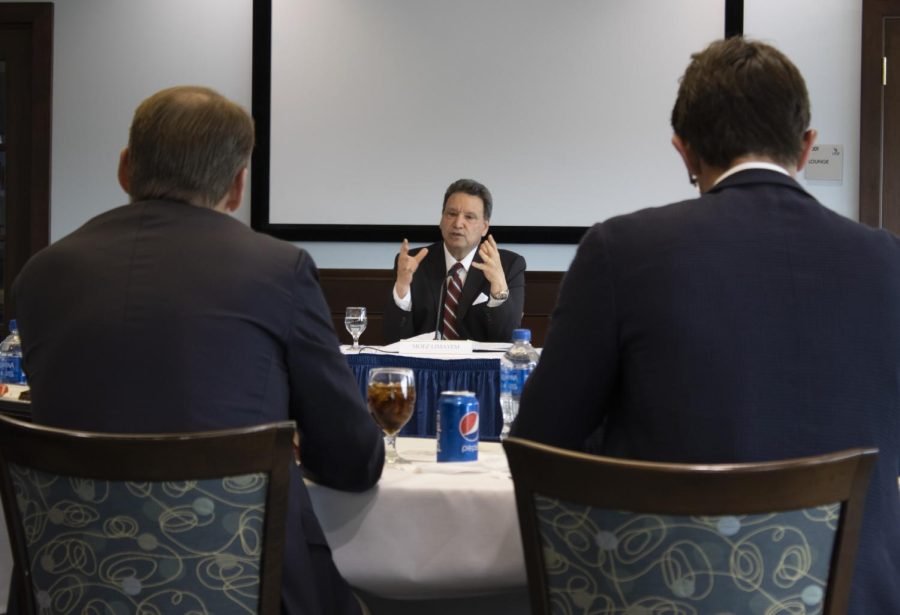 Moez Limayem (center) gestures as he talks to the University of North Florida Board of Trustees