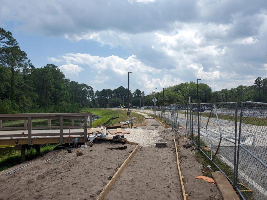The new walkway will open out toward Lot 14 and is set to finish construction by the end of the summer semester.