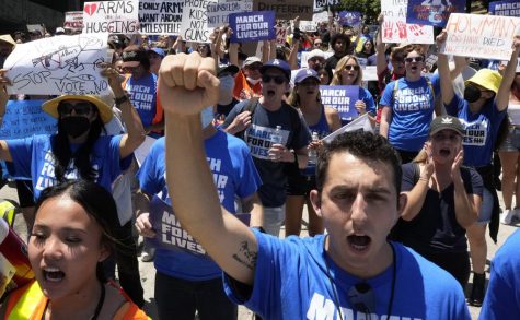 Badim Trubetskoy, of Boston, and a recent graduate of the University of Southern California, marches in downtown Los Angeles during a gun control rally