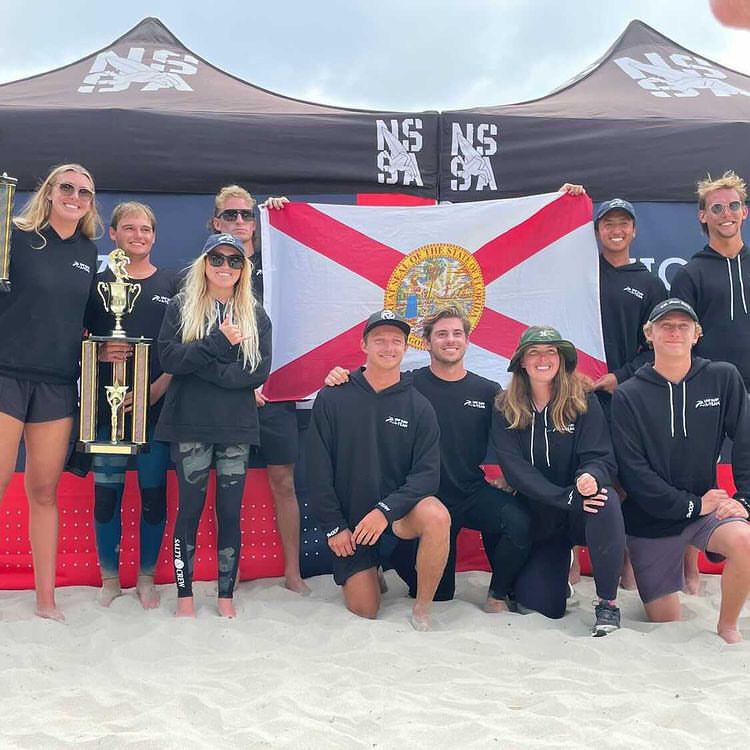 The UNF Surf Team holds their trophies