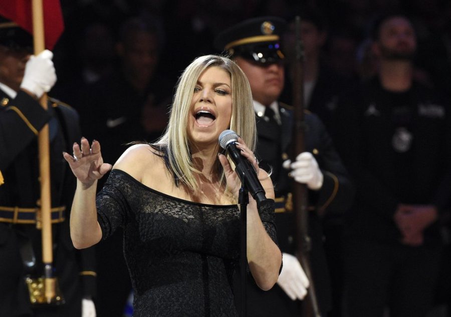 Singer Fergie performs the national anthem prior to an NBA All-Star basketball game,
