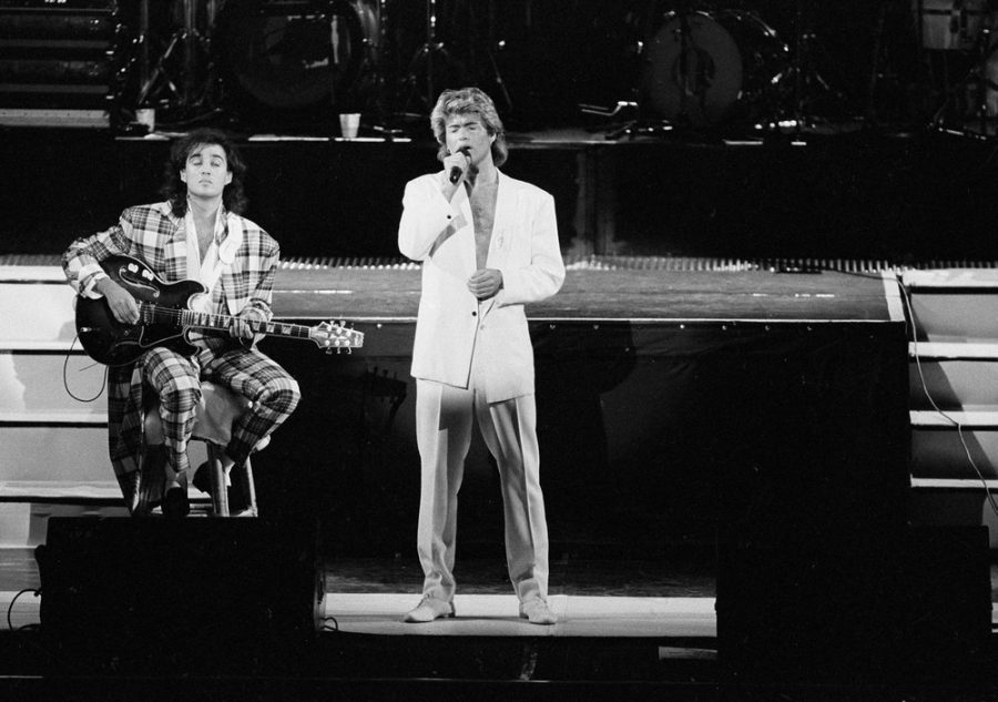 George Michael and Andrew Ridgeley of the British group WHAM! perform during a concert in Peking, China