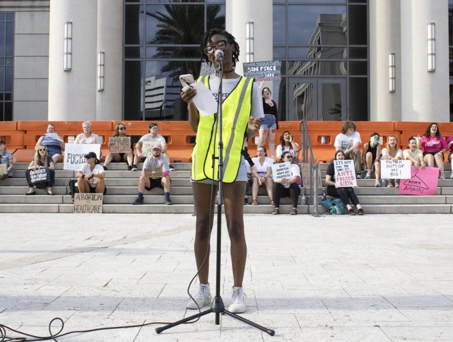 Tionna Jefferson speaks to a crowd