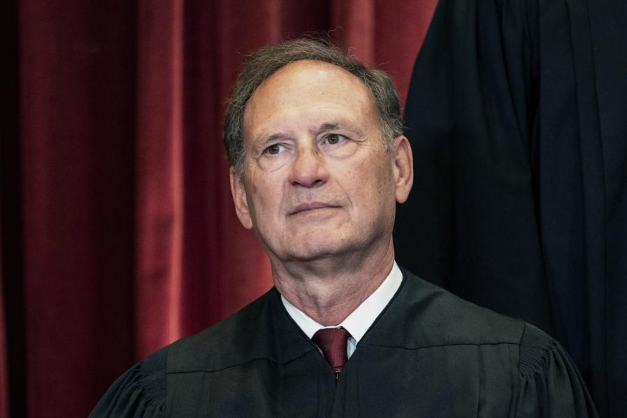 Associate Justice Samuel Alito sits during a group photo at the Supreme Court