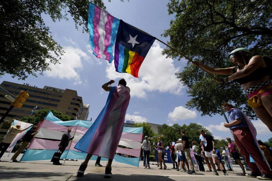 demonstrators gather on the steps to the State Capitol to speak against transgender-related legislation bills being considered in the Texas Senate and Texas House in 2021