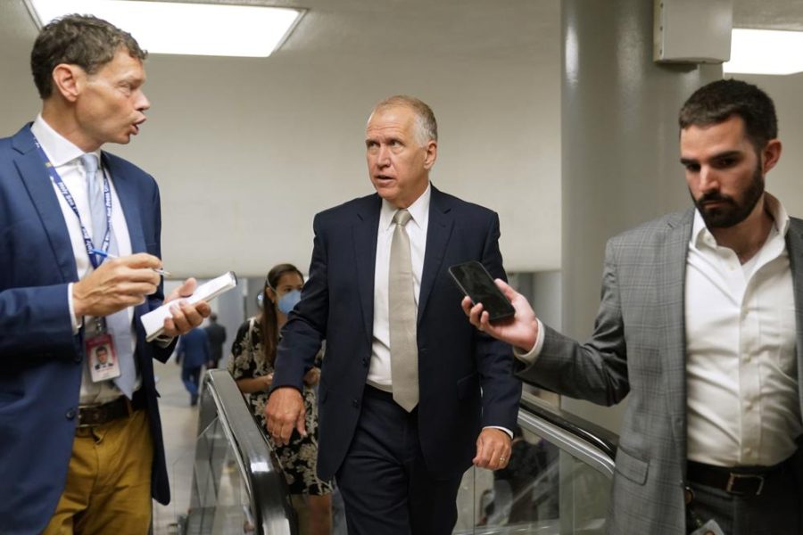 Sen. Thom Tillis, R-N.C., center, speaks with reporters on Capitol Hill