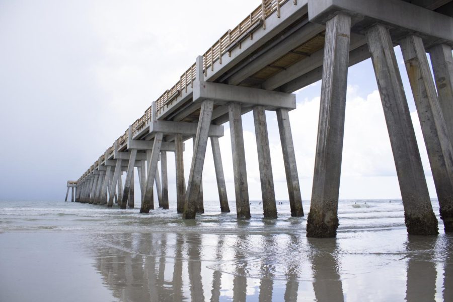 The jax beach pier as seen from underneath at water level