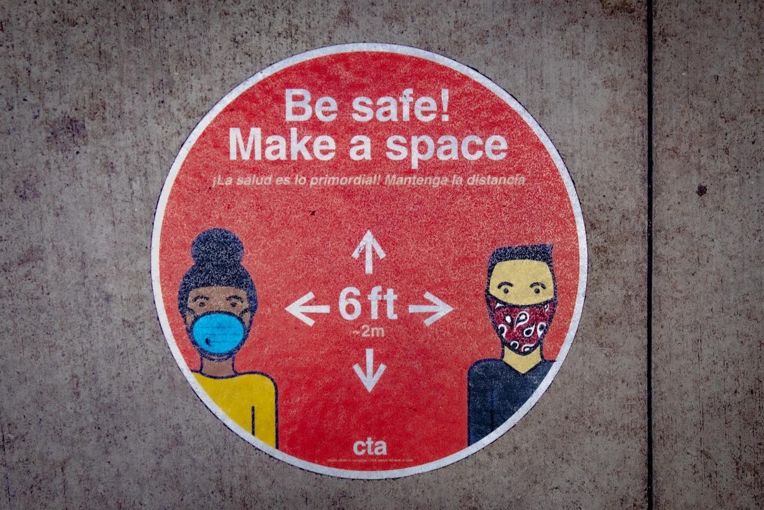 A social distancing sign telling people to "be safe! make space"