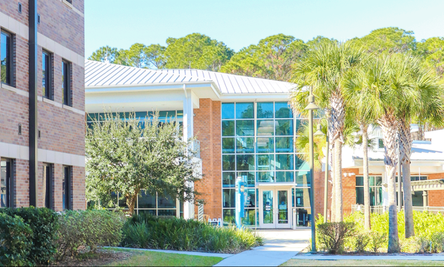 The Clubhouse (glass doors on right) and Osprey Cove (brick building on the left). (Photo courtesy of UNF)