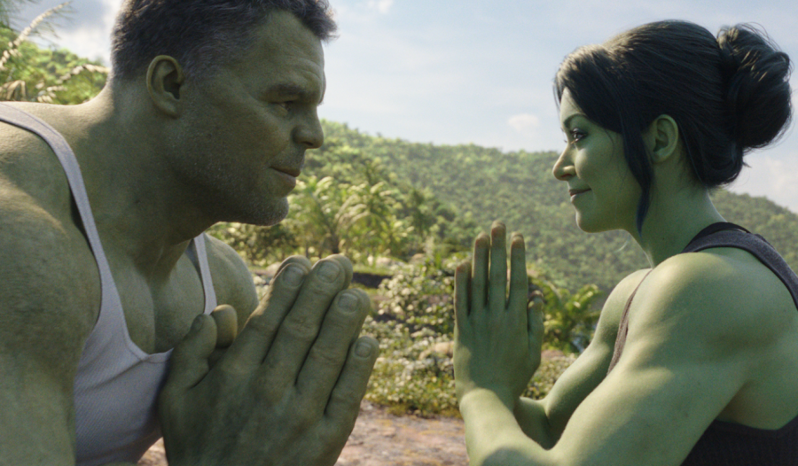 She-Hulk and regular Hulk stand on a mountain looking at eachother while their hands are together in a yoga pose