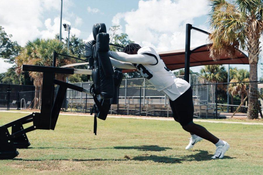 Devin Lloyd #33 Linebacker of the Jacksonville Jaguars pushing the sled during training camp practice on August 8, 2022 at Episcopal’s Knights Sports Complex in Jacksonville, Florida. 