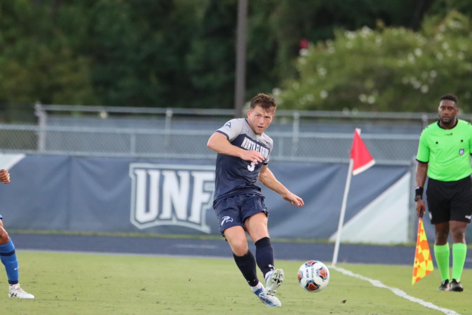 UNF soccer player works the touchline before booting the ball away.
