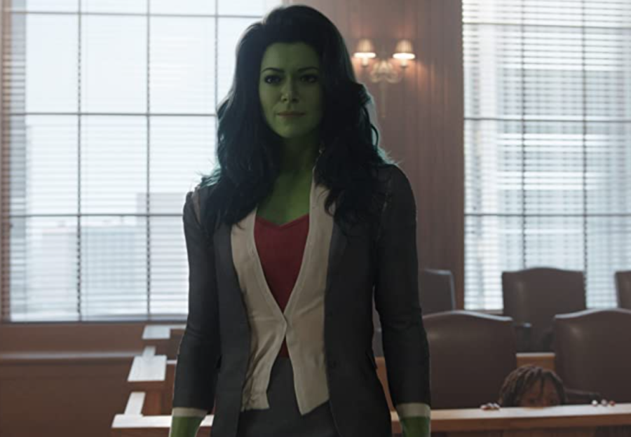 She-Hulk stands in a fancy office dressed in professional attire