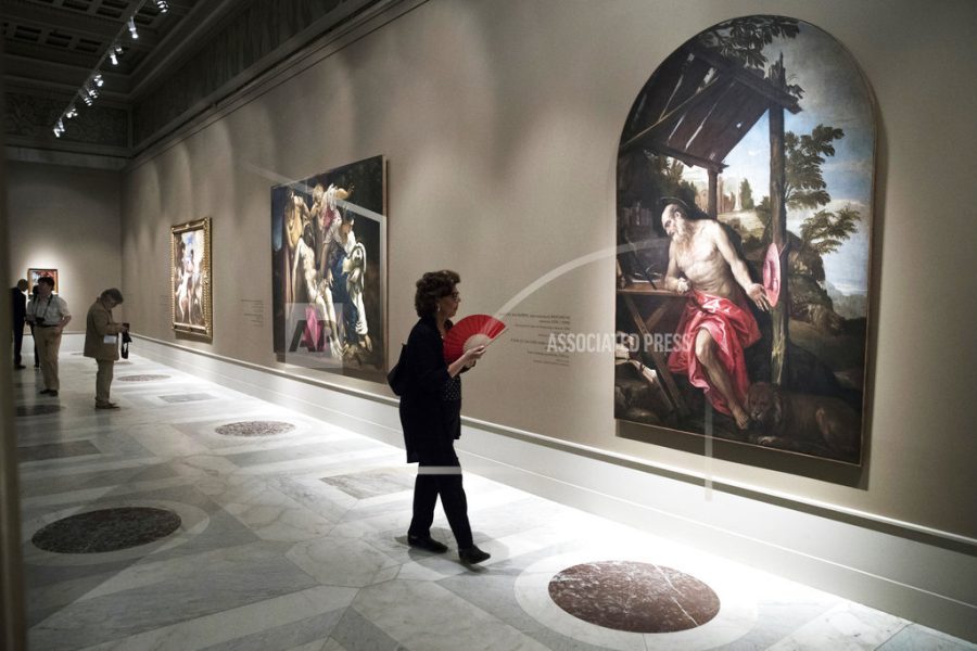 A visitor looks at painting 'Penitent St. Jerome' by Paolo Caliari, known as Paolo Veronese, on display at the the Renaissance Venice exhibition at the Pushkin Fine Arts Museum in Moscow, Russia, Thursday, June 8, 2017. The exhibition features more than 20 paintings by Titian, Veroneze and Tintoretto. (AP Photo/Pavel Golovkin)