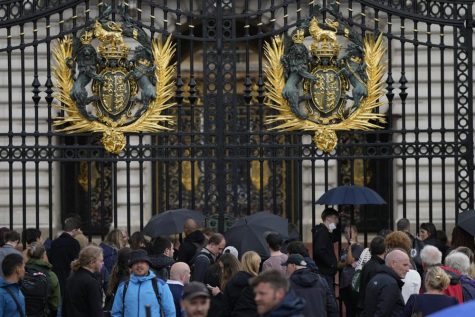 People gather outside Buckingham Palace in London, Thursday, Sept. 8, 2022. Buckingham Palace says Queen Elizabeth II has been placed under medical supervision because doctors are concerned for Her Majestys health. Members of the royal family traveled to Scotland to be with the 96-year-old monarch. (AP Photo/Frank Augstein)