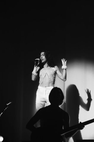 Black and white photo of Conan Gray performing