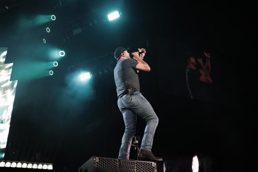 Luke Bryan sings on stage