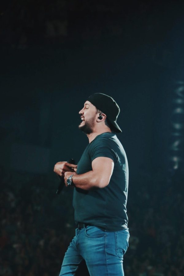 Luke Bryan smiles on stage