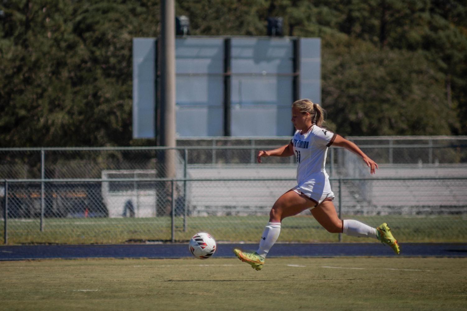 Soccer player dribbling the ball