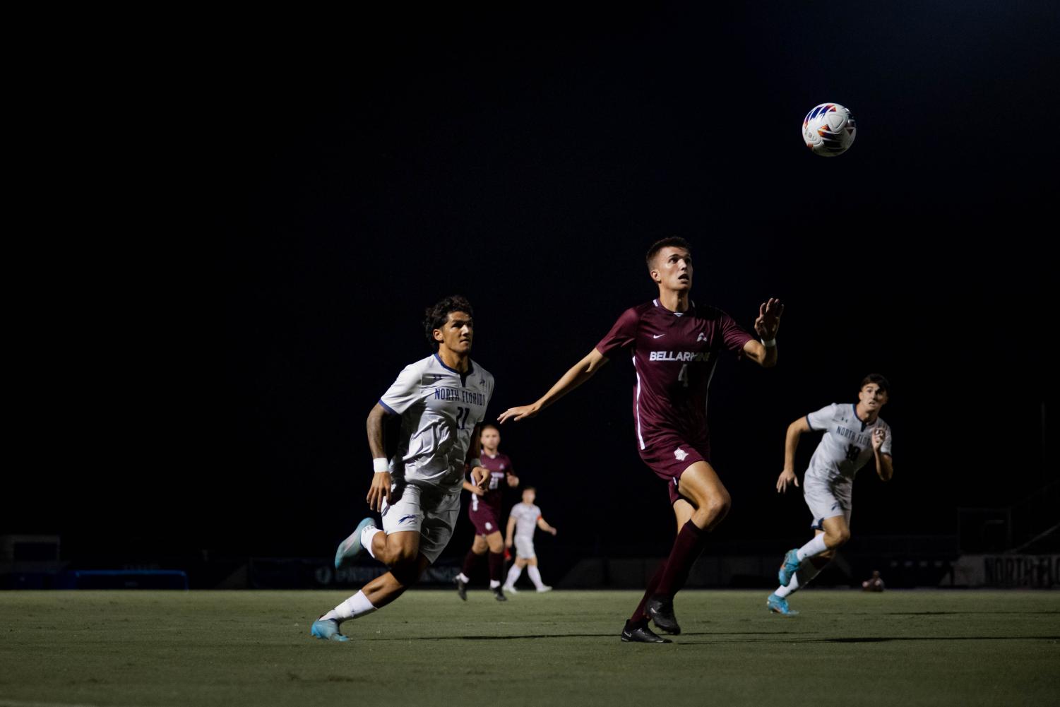 UNF player lurks as Bellarmine player goes to receive pass