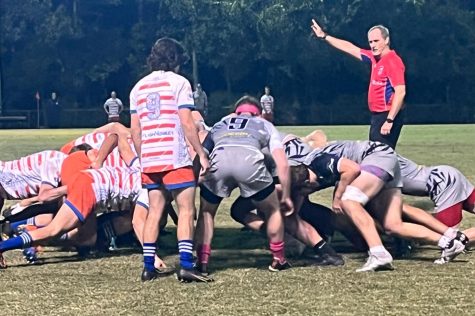 Rugby players deep in action during a game.
