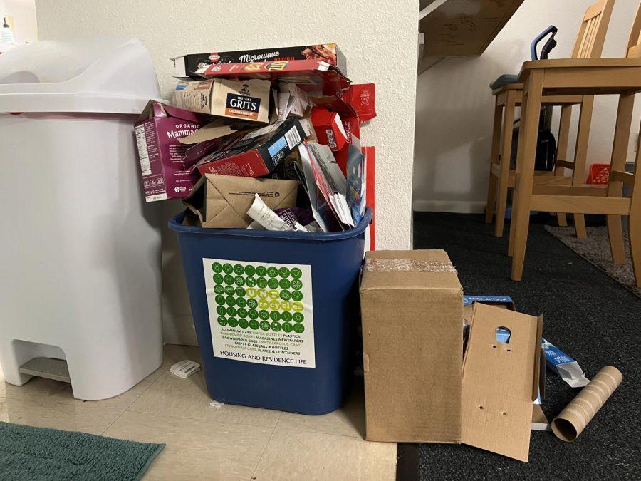 an overflowing recycling bin