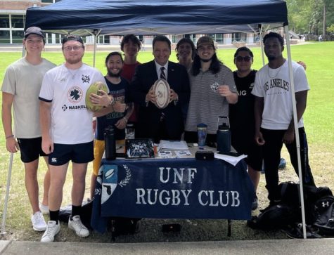 UNF rugby club poses with UNF president
