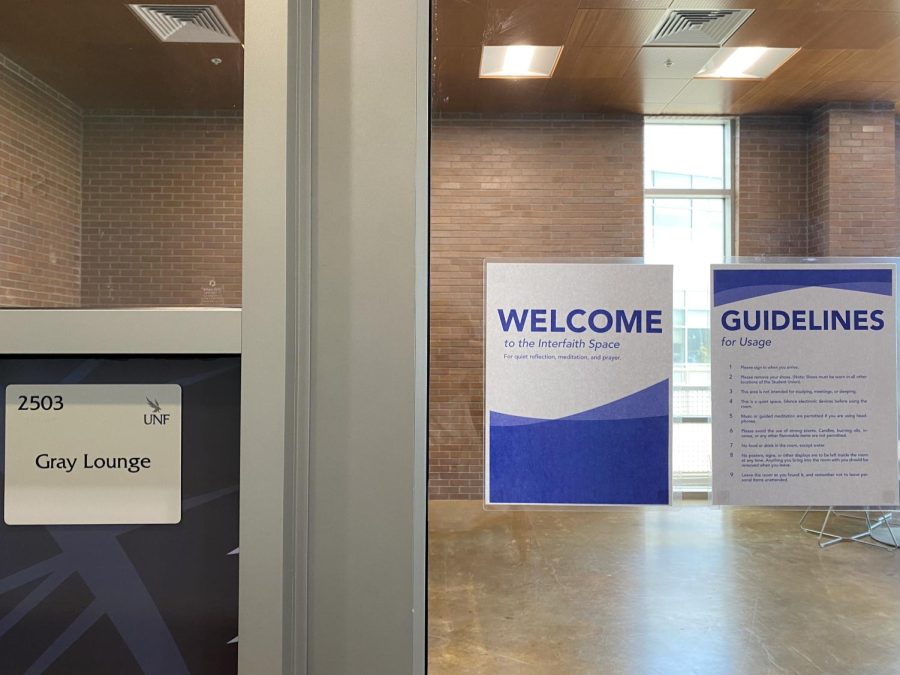 A welcome sign on the glass door