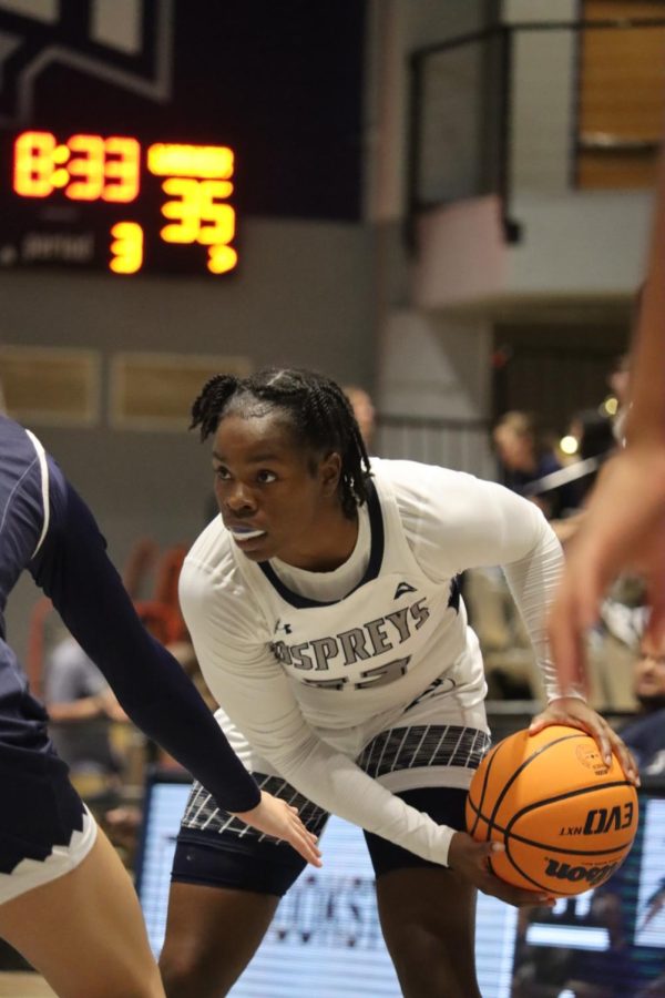 UNF Guard Kaila Rougier #12 being guarded by Warner defender on November 7th, 2022 at UNF Arena in Jacksonville, Florida.
