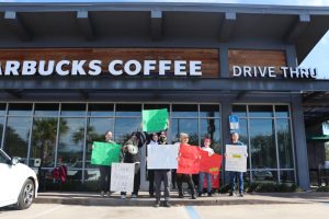 Employees at the San Jose Starbucks location in Jacksonville participated in walk-outs on Thursday that coincided with the company’s Red Cup Day, kicking off the holiday season. 