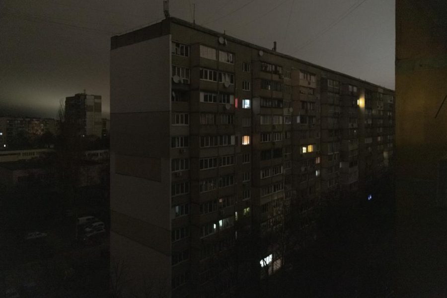 Windows of an apartment building are illuminated during a blackout in central Kyiv, Ukraine, Monday, Nov. 14, 2022. (AP Photo/Andrew Kravchenko)