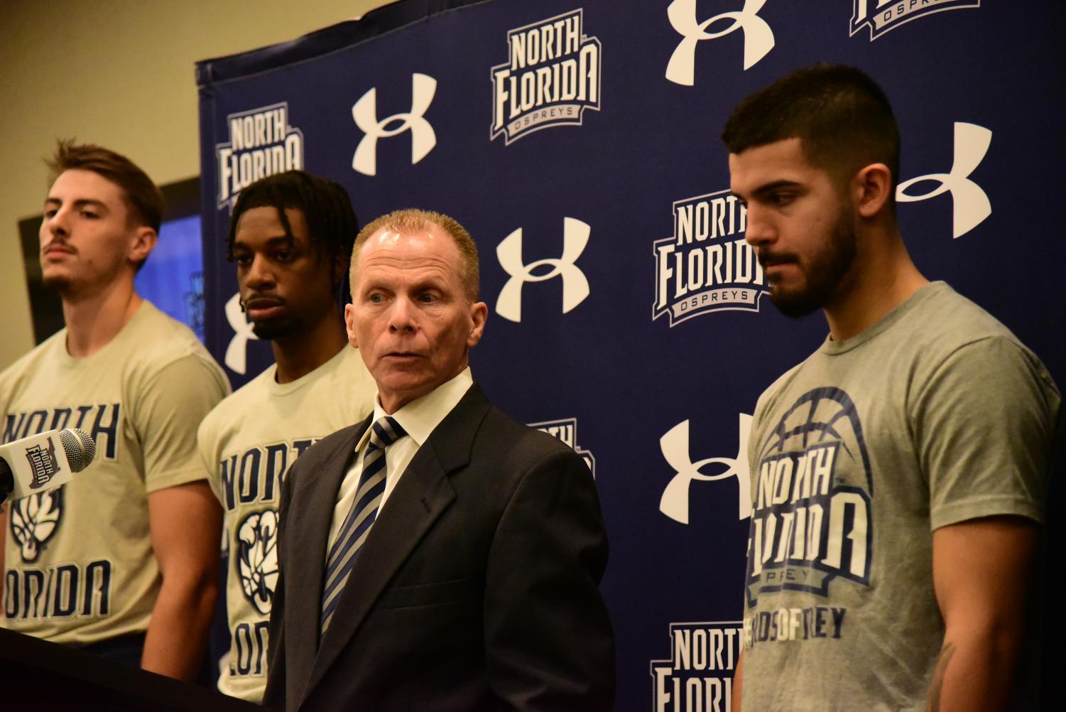 Coach Driscoll listens to question from media member